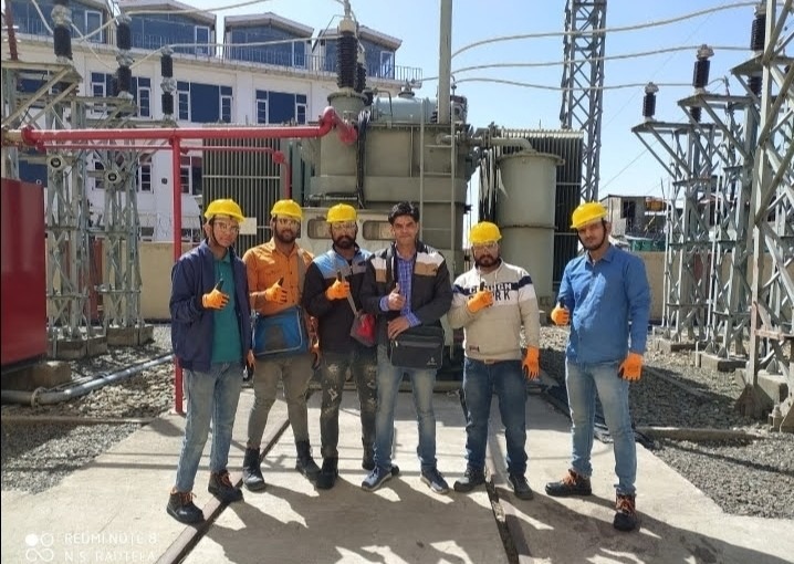 Himalaya Power team at electrical substation with transformer equipment